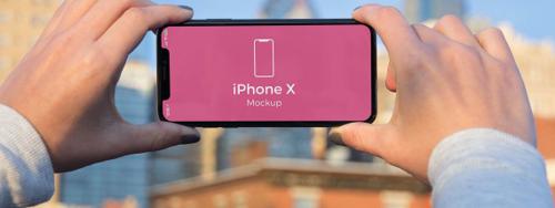 12 Beautiful iPhone In Hand Mockups